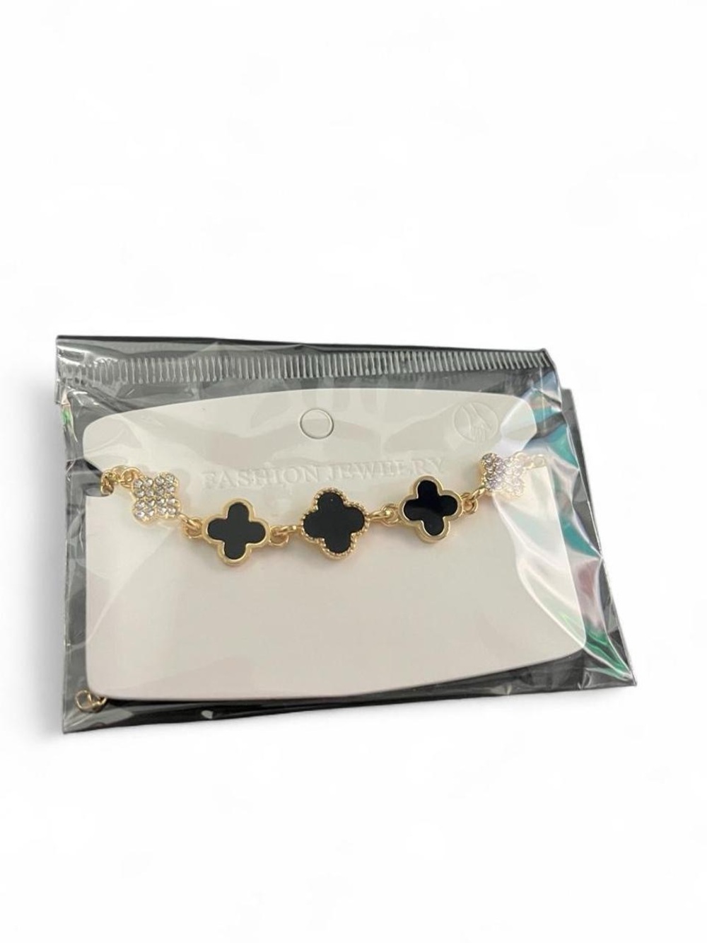 Gold-Tone Bracelet with Black Clover Motifs and Crystal Accents